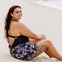 woman on beach wearing swim shorts