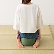 Woman sitted Seiza style on the large sized Seiza Cushion